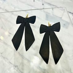 Coquettish black bow clay earrings. 3" in length and 2" in width. Gold colored metal hardware. Stud posts. Jewelry Black, Forest Park, Bow Earrings, Black Bow, Earrings Color, Metal Hardware, Kirby, Jewelry Earrings Studs, Clay Earrings