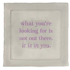 a white pillow with a purple quote on the front saying, what you're looking for is not out there it's in you