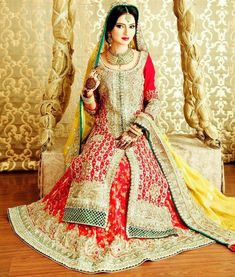 a woman in a red and yellow bridal gown