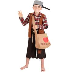 a young boy dressed as a scarecrow holding a bag