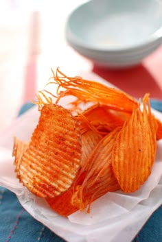 some kind of food that is on top of a paper plate and sitting on a table