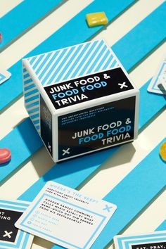 an unopened box of junk food and trivia sitting on top of a table