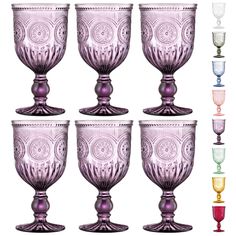 a set of six wine glasses sitting next to each other