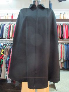 "Beautiful 60s black tailored cape/cloak. No label for fabric but it's doubtless fantstic woollen cloth. It's a very elegant cloak. It closes up to the collar by a long zipper. Hands openings (pic.3). It's fully lined with ivory satin (pic.7). High quality and tailoring. Very chic cape. It fits size S Length (from back neck bottom to hem) 36.6\" - 93 cms In order to avoid any unpleasant misunderstandings please read carefully all the items description before purchasing I measure all my items acc Fitted Black Cape For Work, Black Fitted Cape For Formal Occasions, Formal Fitted Black Cape, Black Wool Cape For Workwear, Fitted Black Formal Cape, One Size Wool Cape Outerwear, Luxury Wool Shawl Cape, Luxury Wool Long Sleeve Cape, Vintage Wool Cape Outerwear