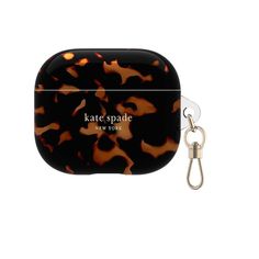 an animal print case with a caramel keychain attached to the front and side