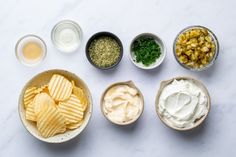 four bowls filled with different types of food