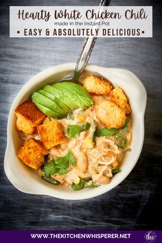 a white bowl filled with chicken and vegetables