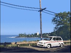 a white van parked on the side of a road next to water and power lines