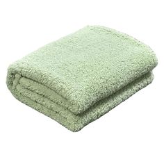 a light green towel folded on top of each other