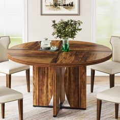 a round wooden table with four chairs around it