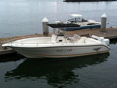 two boats docked at a dock in the water