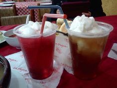 two drinks sitting on top of a red table