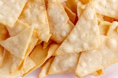 a pile of chips sitting on top of a white plate