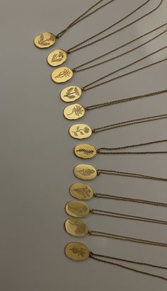 18k gold plated stainless steel reversible birth month necklace. One side has engraved birth flower, other side has birth month and flower name. Perfect for a gift idea or to wear everyday.  Eco-Friendly Nickel & Lead Free Hypoallergenic