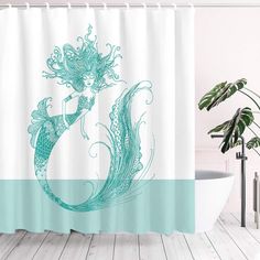 a shower curtain with a mermaid on it