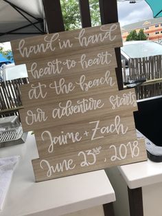 a wooden sign that reads, hunt in nanni meets to heart at the beach our adventure starts june 25, 2018