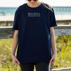 Gildan 64000 Navy Tshirt Mockup D E T A I L S This mockup image is for Gildan 64000 Navy (Unisex T-Shirt Mock up) * Navy Gildan 64000 Oversized Adult Tee * High Resolution Navy Gildan Mockup Tshirt * Summer/ Beach Model Mockup (Model Wearing Size Large) U S A G E How do you use our mockups? EASY! Just place your design on our beautiful model mock up and start selling! R E M E M B E R, after purchase, this image can be used for personal and commercial use. You may not resell, share, or edit this Cotton Crew Neck T-shirt With Branding, Cotton T-shirt With Branding And Short Sleeves, Cotton T-shirt With Branding, Short Sleeve, Cotton Short Sleeve T-shirt With Branding, Crew Neck Cotton T-shirt With Branding, Branded Crew Neck T-shirt With Relaxed Fit, Casual Crew Neck Shirt With Branding, Crew Neck Cotton Shirt With Branding, Cotton Crew Neck Shirt With Branding