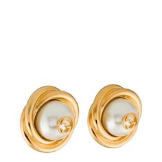 These faux pearl clip-on earrings offer a polished gold rendition of Gucci's iconic GG logo - inspired by an archival design from the '70s. Crafted in Italy, each of these earrings pays homage to Gucci’s proud brand heritage with a small Double G logo perched on a lustrous glass pearl. Twisted, gold-tone metal edging adds a sculptural finish, while the oversized silhouette recalls classic vintage styles. Oversized stud earrings Gold-tone metal Large glass pearls Twisted edging Central Double G l Luxury Gucci Earrings For Evening, Gucci Luxury Evening Earrings, Gucci Round Earrings For Formal Events, Gucci Round Earrings For Formal Occasions, Classic Gucci Earrings, Luxury Gucci Earrings For Formal Occasions, Gucci Gold Earrings For Formal Occasions, Gucci Designer Gold Earrings, Double G Logo