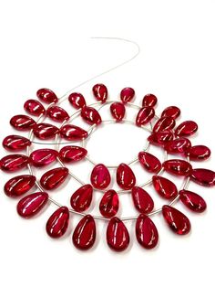 GEMSTONE  - RUBY CORUNDUMSHAPE          -  PEAR (SMOOTHSIZE              -  9.MM WIDTHSIZE              -  13-14. MM LONGLENGTH       -  18 INCH LONG STRANDCOLOUR     -   REDPIECE          -    40 PCS SMOOTH POLISHED RUBY CORUNDUM PEAR SHAPE BEADS VERY BEAUTIFUL FOR MAKING JEWELRYWHOLESALE SHOPIf you have any questions about this item please contact me I will get back to you as soon as.We accept bulk or wholesale orders for any gemstone which you'll get best wholesale prices! Hence you can conta Teardrop Polished Beads Necklace Gift, Teardrop Polished Beads Necklace For Gift, Teardrop Polished Bead Necklace For Gift, Faceted Drop Beads For Jewelry Making, Teardrop Gemstone Beads Necklaces For Jewelry Making, Teardrop Gemstone Beads Necklace For Gift, Padparadscha Sapphire, Ruby Beads, Orange Sapphire