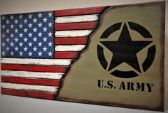 an american flag and the u s army emblem on a wooden sign hanging on a wall