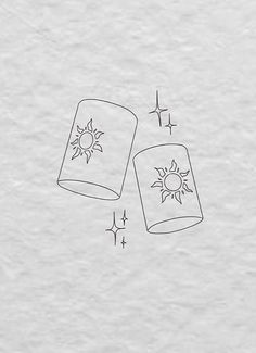 two jars with the sun and stars drawn on them, one is upside down in front of the other