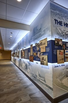 a wall that has pictures on it with the words the history written in blue and white