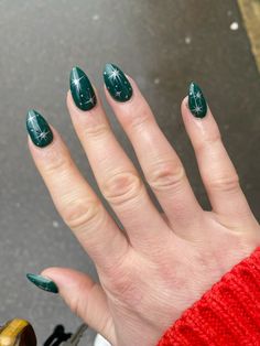 Green nail with metallic silver stars Green And Stars Nails, Emerald Green Celestial Nails, Glitter Dark Green Nails, Emerald Nails With Silver, Green And Silver Nails Short, Green Stars Nails, Dark Green Nails Designs Short, Dark Green Nails With Silver, Green Nails With Stars