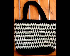 "Hand-crocheted tote bag. 16\" wide, 14\" deep. Handles are 18\" with a drop length of 8\" Attractive puff braid stitch in sage green, black and cream. This bag is unlined. Made of easy care, non allergenic acrylic yarn. Machine wash and dry gentle cycle in cool water." Black Crochet Bag With Granny Square For Everyday Use, Black Tote Bag With Granny Square Detail, Black Granny Square Crochet Tote Bag, Black Granny Square Bag For Daily Use, Black Granny Square Tote Bag, Braid Stitch, Beach Bag Crochet, Puff Stitch, Crochet Purse