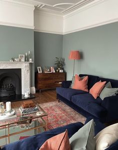 a living room filled with furniture and a fire place