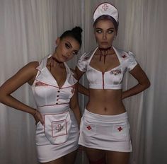 two women dressed as nurses standing next to each other