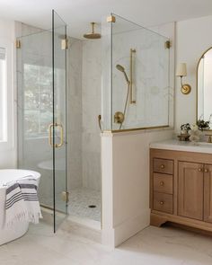 a bath room with a sink a mirror and a tub