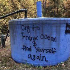 a large blue barrel with writing on it