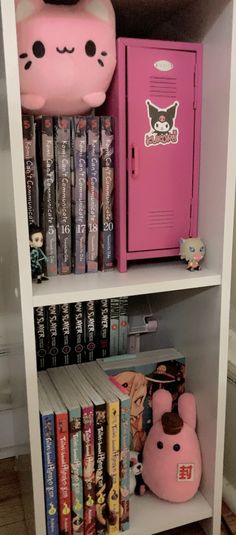 a book shelf filled with books next to a pink locker and stuffed animal toy on top of it