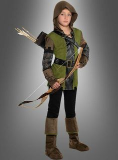 a young boy dressed in a costume holding a bow and arrow