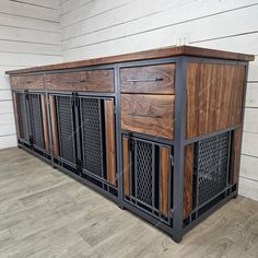 the sideboard is made out of wood and metal, with an iron grille design