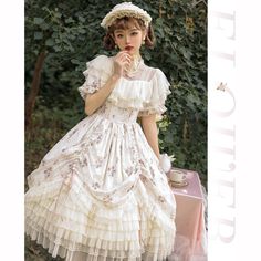 A classic dress and embroidered bonnet for a beautiful Western queen. A gorgeous item that combines pale pink roses and a geometric checkered pattern. The chest and hem are decorated with ruffles that have a strong presence. She is an elegant young lady who is as pretty as a flower. 
 
 
 
 Item 
 
 One Piece 
 Bonnet 
 
 
 Size 
 
 One Piece 
 
 S size 
 
 Length: 103cm 
 Shoulder width: 34.5cm 
 Bust: 88cm 
 Waist: 72cm 
 Sleeve length: 24cm 
 
 M size 
 
 Length: 105cm 
 Shoulder width: 35.5c Princesscore Ruffle Dress For Garden Party, Princesscore Ruffled Dresses For Garden Party, Spring Cream Victorian Dress With Ruffles, Summer Vintage Dress With Ruffles For Tea Party, Summer Princesscore Dress With Lace Trim, Vintage Square Neck Dress With Ruffles For Garden Party, Cottagecore White Dress For Tea Party, Square Neck Vintage Dress With Ruffles For Garden Party, Cottagecore Cream Vintage Dress With Ruffles