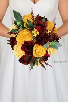 a bridal holding a bouquet of yellow and red flowers