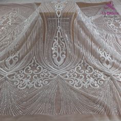 Price: The price is for 1 yard. if you buy more than 1 yard ,it won't be cut. will come in one piece the longest is 20 yards. Material: polyester,sequins,beads Fixed Wide : 130 cm or 51 inches. color:off white Want to see other colors and more similar Beading lace fabrics come to: https://www.etsy.com/shop/Randyfabrics?ref=hdr_shop_menu&section_id=14192305 Shipping: Choose the shipping way you need, if you want package shipped by express,please note the phone number on order. Use for Dress,c White Embellished Embroidered Fabric For Banquet, White Pearl Embroidered Fabric For Banquet, White Sequined Wedding Dress For Banquet, Fitted White Embroidered Fabric For Banquets, Fitted White Embroidered Fabric For Banquet, White Lace Sequin Fabric With Pearl Embroidery, White Tulle Fabric With Intricate Embroidery For Party, White Embroidered Tulle Fabric For Party, Off White Wedding Dresses