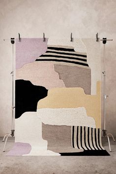 an area rug with different colors and shapes