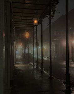 an empty street at night in the fog