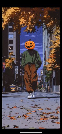 a person wearing a pumpkin hat walking down the street