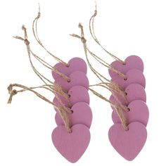 pink heart shaped wooden tags with twine on white background