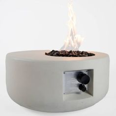 an outdoor fire pit is shown with the lid open