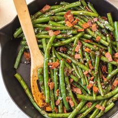 green beans and bacon cooking in a skillet