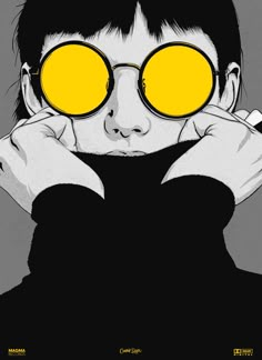 a person with yellow glasses on their eyes