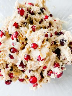 a white plate topped with cranberry cookies