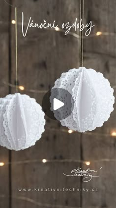 two white doily hanging from strings with lights in the background and text that reads, valentine's assembly