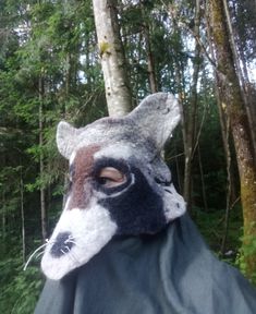 Unleash your wild side with this felted raccoon mask! Crafted with precision and attention to detail, this unisex adult mask captures the mischievous charm of these furry bandits. The soft, felted wool material ensures a comfortable fit, while the intricate detailing brings the mask to life. Whether you're attending a costume party, exploring the great outdoors, or simply indulging your playful side, this raccoon mask is sure to turn heads. Slip it on and let your inner trickster loose for a nig Mask Theater, Felted Raccoon, Raccoon Mask, Theater Mask, Therian Mask, Wolf Mask, Animal Mask, Carnival Mask, Wolf Face