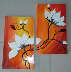 two pieces of art with white flowers on orange and yellow background, one is painted in acrylic paint