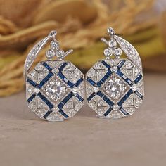 Antique Edwardian 14K White Gold Earrings/ Floral Ear Wire Earrings/ Edwardian Sapphire Earrings/ Round White Diamond Engagement Earrings 💎 𝐄𝐀𝐑𝐑𝐈𝐍𝐆𝐒 𝐈𝐍𝐅𝐎𝐑𝐌𝐀𝐓𝐈𝐎𝐍: ✪ All Stone Type: Simulated Diamond ✪ All Stone Shape: Round Cut  ✪ Color: D/E (Colorless) ✪ Clarity: IF (Internally Flawless) ✪ Cut Grade: Excellent ● 𝐌𝐄𝐓𝐀𝐋 𝐃𝐄𝐓𝐀𝐈𝐋𝐒: ✪ Metal Type:- 𝟗𝟐𝟓 𝐒𝐢𝐥𝐯𝐞𝐫 / 𝟗𝟑𝟓 𝐀𝐫𝐠𝐞𝐧𝐭𝐢𝐮𝐦 𝐬𝐢𝐥𝐯𝐞𝐫/ 𝟏𝟎𝐊𝐓/𝟏𝟒𝐊𝐓/𝟏𝟖𝐊𝐓 𝐒𝐨𝐥𝐢𝐝 𝐆𝐨𝐥𝐝/𝗣𝗹𝗮𝘁𝗶𝗻𝘂? Art Deco Hallmarked Drop Earrings, Hallmarked Art Deco Earrings For Anniversary, Art Deco Round Pierced Earrings, Art Deco Diamond Cut Earrings For Wedding, Art Deco Diamond Cut Wedding Earrings, Art Deco Drop Diamond Earrings For Anniversary, Victorian Drop Earrings For Anniversary, Art Deco White Gold Earrings For Gift, Art Deco Diamond Cut Earrings